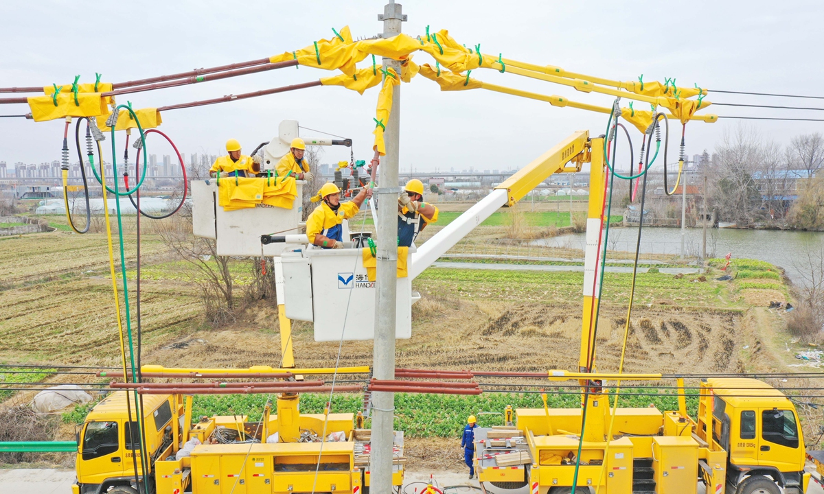 Inspectors carry out checks and conduct maintenance on the power supply lines at a local agricultural company in Chuzhou, East China's Anhui Province on February 27, 2023, aiming to ensure adequate electricity supply for agricultural production and the spring ploughing season. Photo:cnsphoto