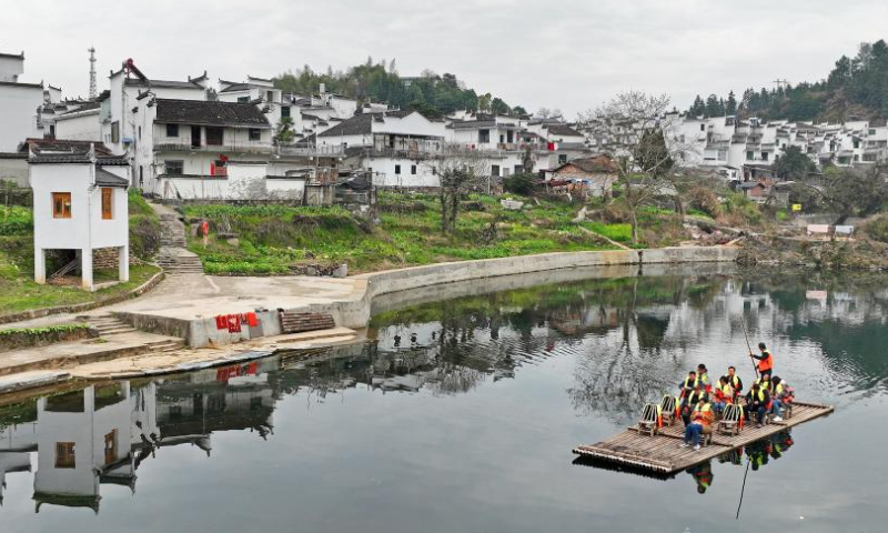Tourists take a bamboo raft in Qinghua Township, Wuyuan County of east China's Jiangxi Province, March 3, 2023. Spring scenery in Wuyuan attracts lots of visitors with the rising of temperature. (Xinhua/Wan Xiang)