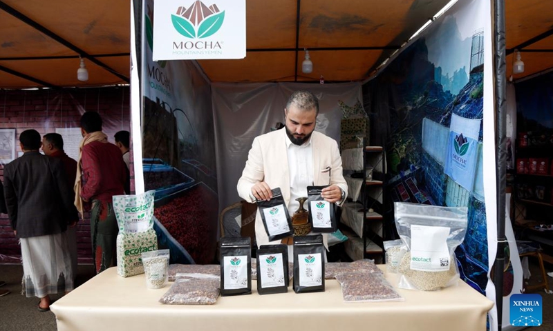 A coffee merchant displays products at a coffee fair in Sanaa, Yemen, on March 1, 2023. Local merchants gathered at the coffee fair on Wednesday to promote Yemen's renowned coffee.(Photo: Xinhua)