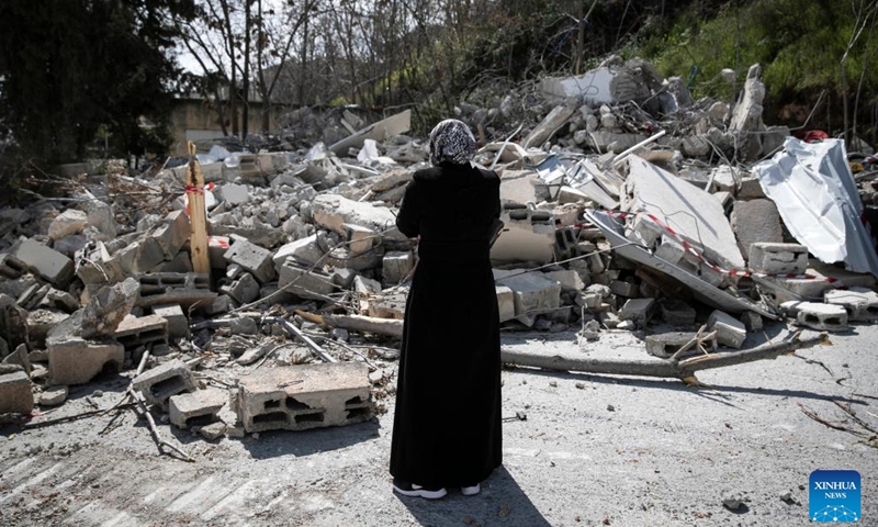 The resident of a demolished house reacts in front of the ruins, Wadi al-Joz neighborhood, East Jerusalem, March 6, 2023.(Photo: Xinhua)