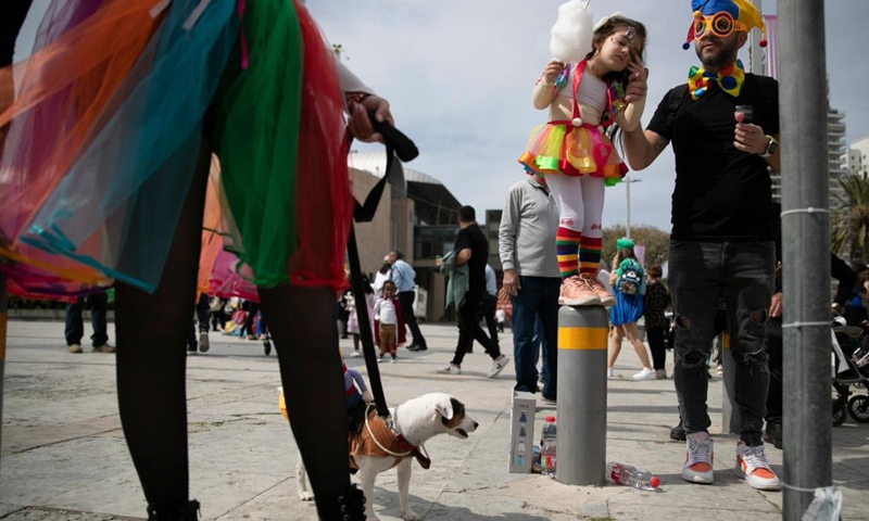 People in costumes are seen during Adloyada Holon Purim Parade 2023 in Holon, central Israel, on March 7, 2023. Purim is a Jewish holiday that commemorates the deliverance of the Jewish people from Haman's plot during the reign of the ancient Persian Empire, according to the Biblical Book of Esther.(Photo: Xinhua)