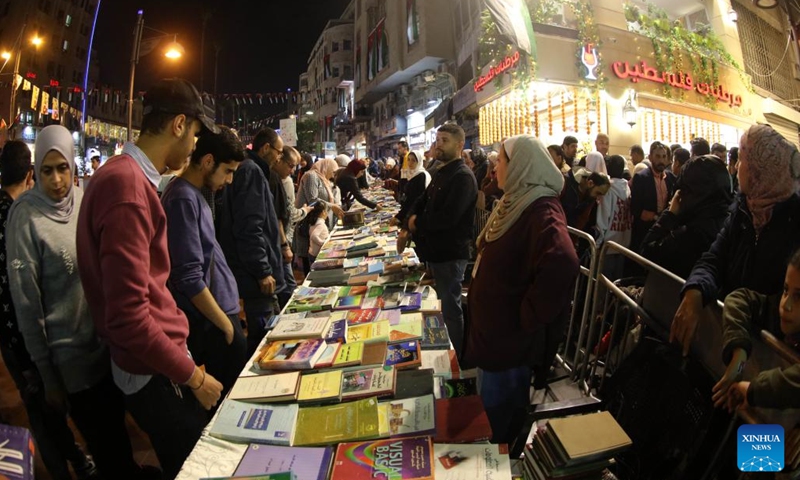 People attend a free book distribution activity during the Amman City Day celebrations in Amman, Jordan, on March 2, 2023.(Photo: Xinhua)