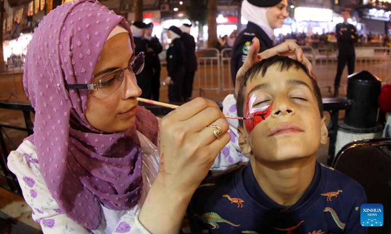 A boy has face painted during the Amman City Day celebrations in Amman, Jordan, on March 2, 2023.(Photo: Xinhua)