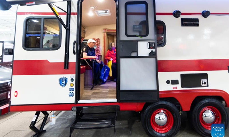 People look at a travel trailer during the 2023 Toronto Spring Camping & RV Show in Mississauga, the Greater Toronto Area, Canada, on March 2, 2023. The annual event is held here from March 2 to March 5 with over 450 RVs.(Photo: Xinhua)