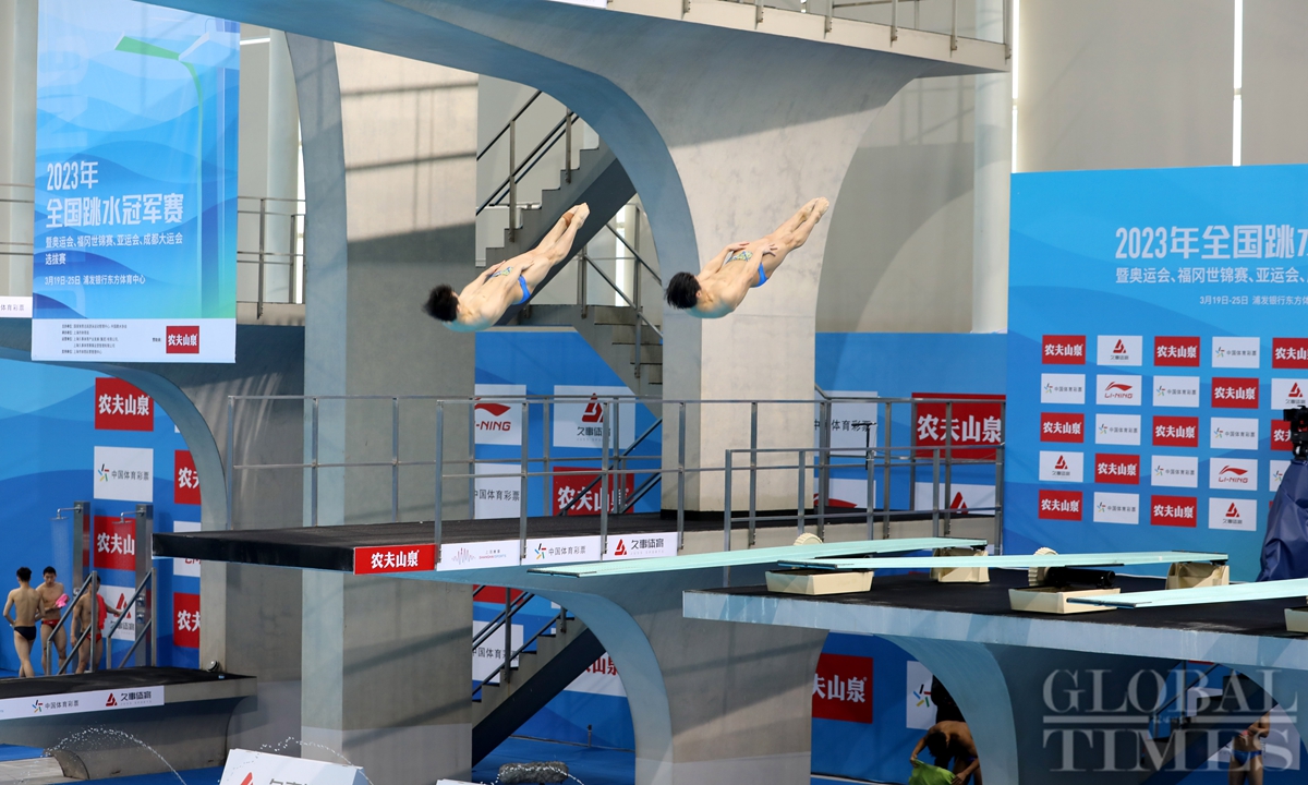 Athletes compete at men’ssynchronized 3-m springboard match at China ...