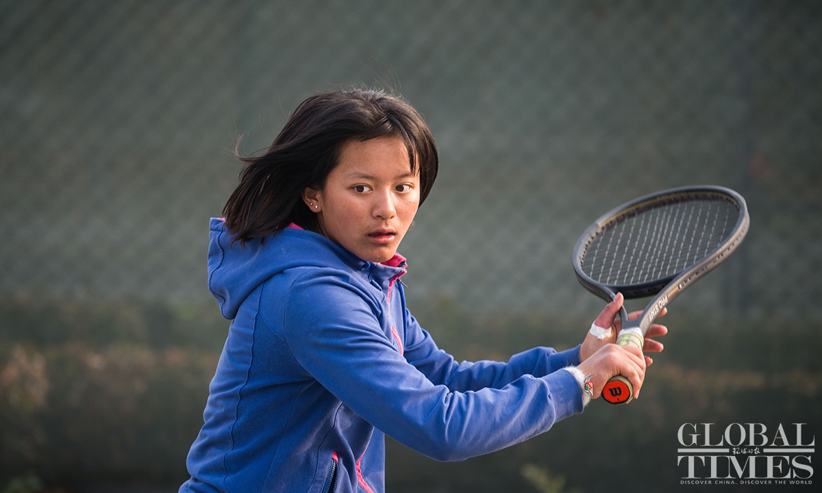 As part of their daily training, teenage players at the Wild Elephant Tennis Club are required to complete at least 7,000 serves. Most of them have been playing for six or seven years, and 10 of the 18 teenage players have won national tennis titles. Photo: Chen Tao/GT