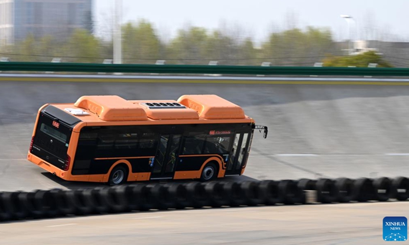 A new energy bus is tested at the test site of Zhengzhou Yutong Bus Co., Ltd. in Zhengzhou, central China's Henan Province, March 8, 2023. To catch orders, staff of the new energy factory of Yutong are busy on the assembly line. Since the beginning of this year, Yutong. who exported its bus to more than 30 countries and regions, has won many overseas orders.(Photo: Xinhua)