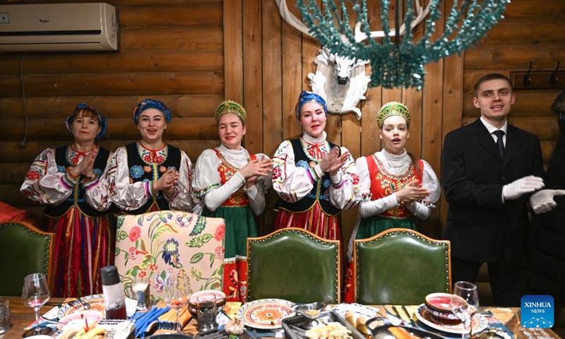 Russian waiters stage a performance at a Russian restaurant in Manzhouli, north China's Inner Mongolia Autonomous Region, March 15, 2023. Popularity of Russian goods and foods has revived among local customers after the land port of Manzhouli resumes services. (Xinhua/Bei He)