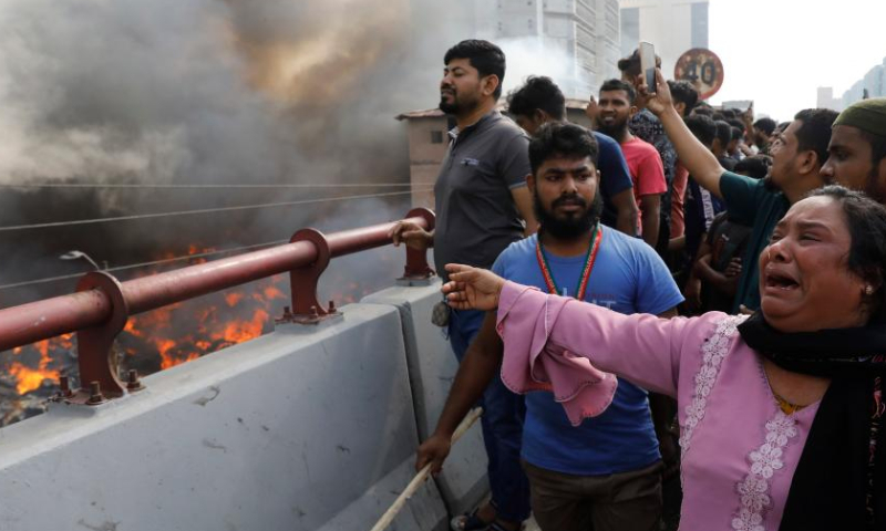 A woman cries for her loss near the site where a fire broke out at a market in Dhaka, Bangladesh, on April 4, 2023. A fire gutted thousands of shops in a market in a residential neighborhood of the old part of Dhaka on Tuesday morning, destroying goods and property. (Xinhua)