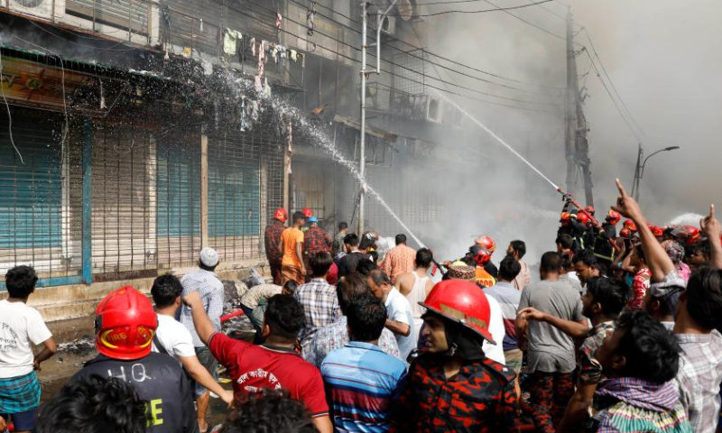 Firefighters battle a fire at a market in Dhaka, Bangladesh, on April 4, 2023. A fire gutted thousands of shops in a market in a residential neighborhood of the old part of Dhaka on Tuesday morning, destroying goods and property. (Xinhua)