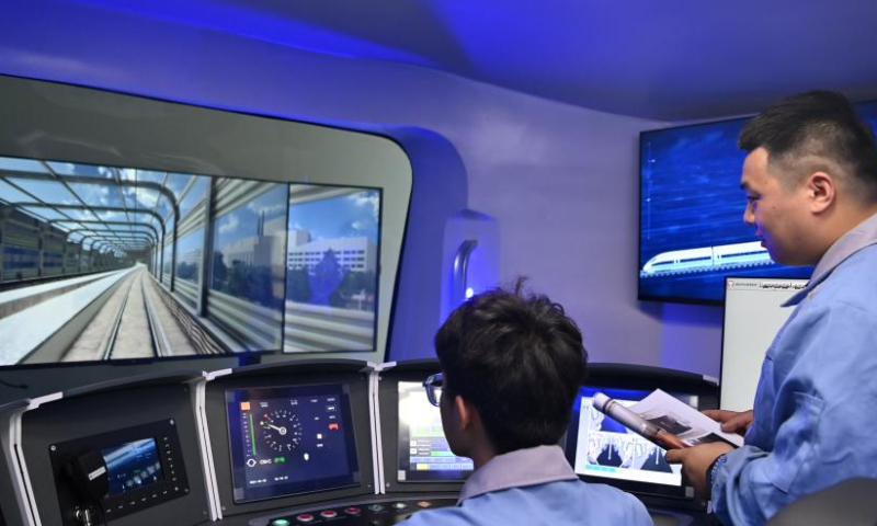 

Employees work in a driving simulator of Traffic Control Technology Equipment Co., Ltd. in Wuqing District, north China's Tianjin, April 3, 2023. The Traffic Control Technology Equipment Co., Ltd. in north China's Tianjin is seeing a continuous increase in order volume this year. Inside the factory, dozens of machines are running at full capacity, and rows of circuit boards for the train operation control system are waiting to be delivered after rolling off automatic production lines.

Headquartered in Beijing, the enterprise officially went into production in 2020. It has reduced the operation cost by about 30% thanks to the supportive polices provided by the coordinated development of the Beijing-Tianjin-Hebei region. (Xinhua/Li Ran)