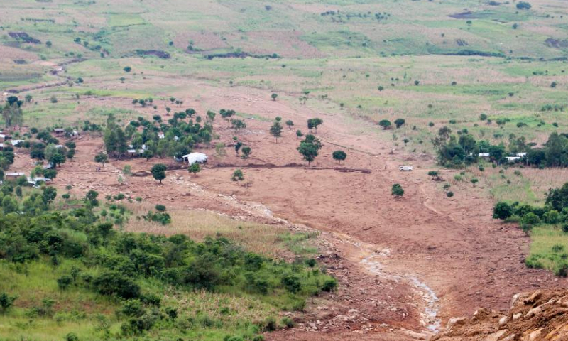 This photo taken on April 1, 2023 shows the path of Cyclone Freddy-induced mudslides in Chiradzulu, Malawi. The cyclone, which hit the southern part of the country hard from the night of March 12, also left about 2,000 people injured, and 650,000 people displaced. (Photo by Roy Nkosi/Xinhua)