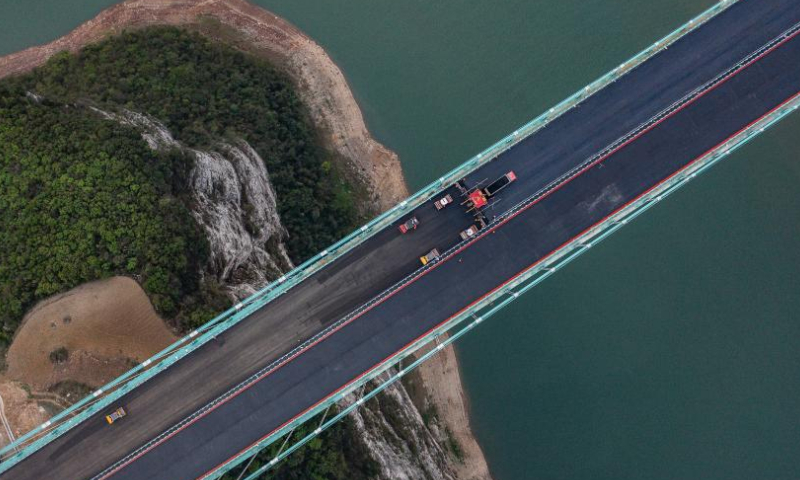 This aerial photo taken on April 3, 2023 shows the construction site of the Jinfeng Wujiang River Bridge in southwest China's Guizhou Province. The bridge, featuring a length of 1473.5 meters, is a main project on the Guiyang-Jinsha-Gulin (Guiyang and Jinsha of Guizhou Province and Gulin of Sichuan Province) expressway. (Xinhua/Tao Liang)