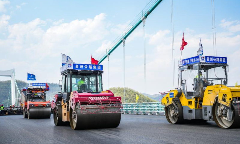 This photo taken on April 3, 2023 shows the construction site of the Jinfeng Wujiang River Bridge in southwest China's Guizhou Province. The bridge, featuring a length of 1473.5 meters, is a main project on the Guiyang-Jinsha-Gulin (Guiyang and Jinsha of Guizhou Province and Gulin of Sichuan Province) expressway. (Xinhua/Tao Liang)