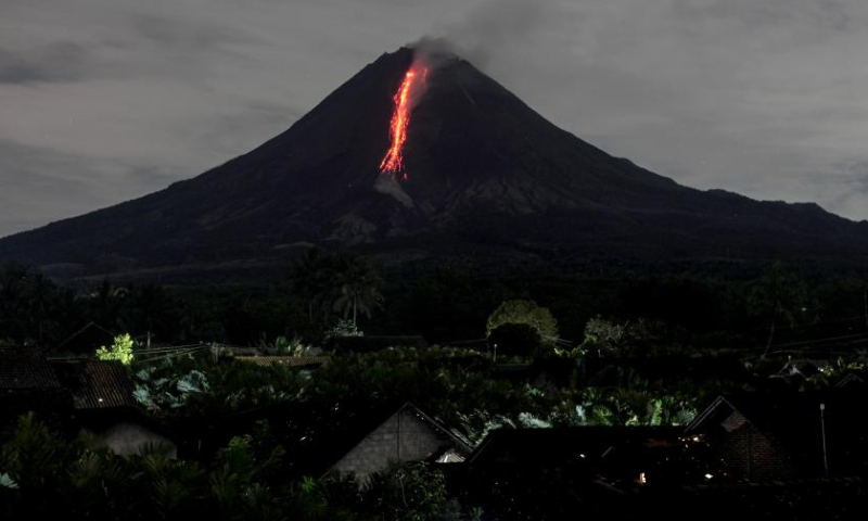 Volcanic materials spew from Mount Merapi volcano as seen from Srumbung village in Magelang, Central Java, Indonesia, March 28, 2023. (Photo by Priyo Utomo/Xinhua)