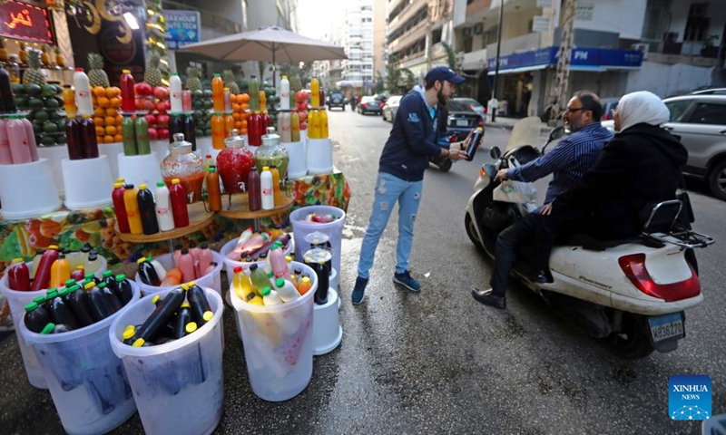 A juice seller promotes his products in Beirut, Lebanon, on March 26, 2023. (Xinhua/Bilal Jawich)