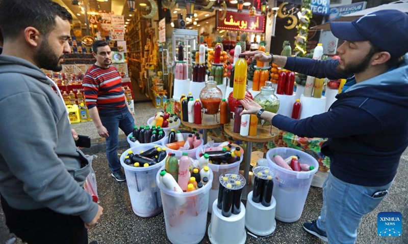 A juice seller promotes his products in Beirut, Lebanon, on March 26, 2023. (Xinhua/Bilal Jawich)