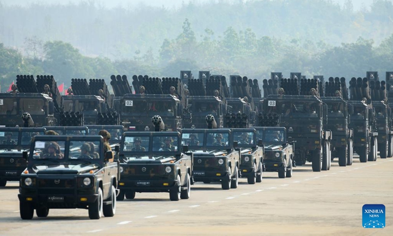 A formation of military vehicles proceeds during a military parade to mark the 78th Armed Forces Day in Nay Pyi Taw, Myanmar, March 27, 2023. Myanmar celebrated its 78th Armed Forces Day on Monday with a military parade in the capital Nay Pyi Taw in commemoration of the start of its anti-fascist movement during World War II. (Photo by Myo Kyaw Soe/Xinhua)