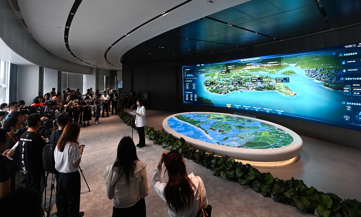 Media groups at the Boao Forum for Asia Annual Conference 2023 visit the operation and manage center for the zero-carbon emissions demonstration zone on Boao's Dongyu Island on March 30, 2023. This year's Boao Forum focuses on green development and energy issues. Photo: Xinhua