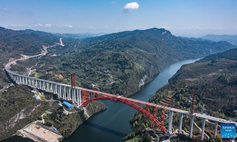 This aerial photo taken on March 30, 2023 shows the Wujiang grand bridge, a main project on the expressway linking Dejiang and Yuqing, in southwest China's Guizhou Province. The main body of the Wujiang Bridge was completed on Thursday. The bridge, located at the junction of Sinan, Shiqian and Fenggang counties of Guizhou Province, features a length of 1,834 meters and a span of 504 meters.(Photo: Xinhua)