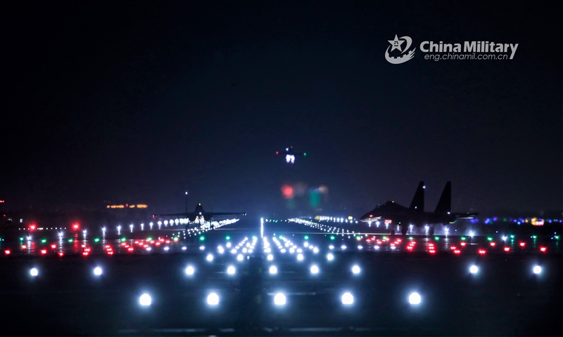 Fighter jets attached to an aviation brigade of the air force under the PLA Southern Theater Command taxi out to the runway during a day-and-night flight training exercise on March 11, 2023. (eng.chinamil.com.cn/Photo by Hao Hunan)