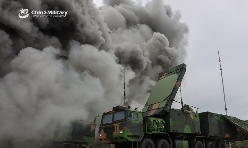 Vehicle-mounted radar systems attached to a surface-to-air missile brigade with the air force under the PLA Southern Theater Command use smoke to cover movement during a joint training exercise held by the brigade and a chemical defense unit in late March, 2023. (eng.chinamil.com.cn/Photo by Wang Junfa)