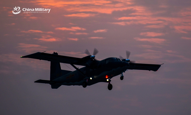 A Y-12 transport aircraft attached to an air transport brigade under the PLA Air Force's airborne troops takes off during the intensive round-the-clock flight training recently. (eng.chinamil.com.cn/Photo by Li Zhuojun)