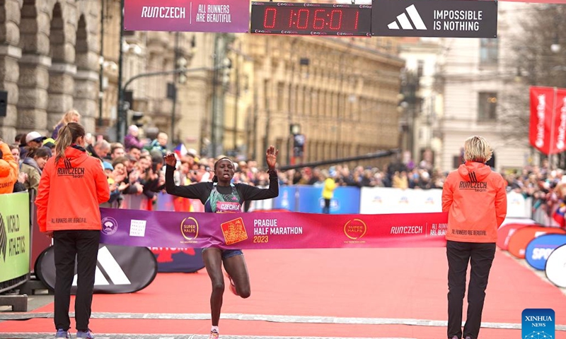 First-place finisher Irine Jepchumba Kimais from Kenya (C) crosses the finishing line during the women's race of Prague Half Marathon 2023 in Prague, the Czech Republic, on April 1, 2023. Prague Half Marathon 2023 was held on Saturday. (Photo by Dana Kesnerová/Xinhua)