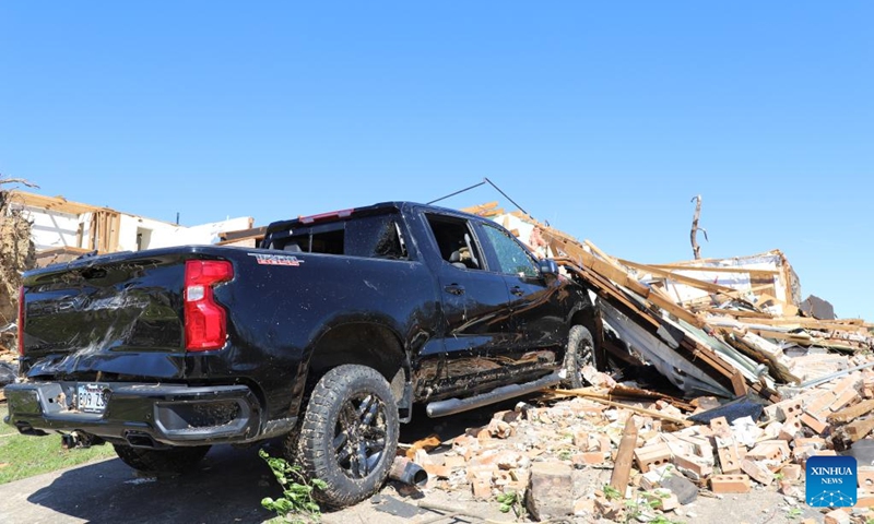 This photo taken on April 1, 2023 shows a pickup damaged by a strong tornado in Little Rock, Arkansas, the United States. At least 21 people have been killed and more than 130 others injured after strong tornadoes and deadly storms struck multiple midwestern and southern U.S. states Friday into early Saturday, authorities said.(Photo: Xinhua)