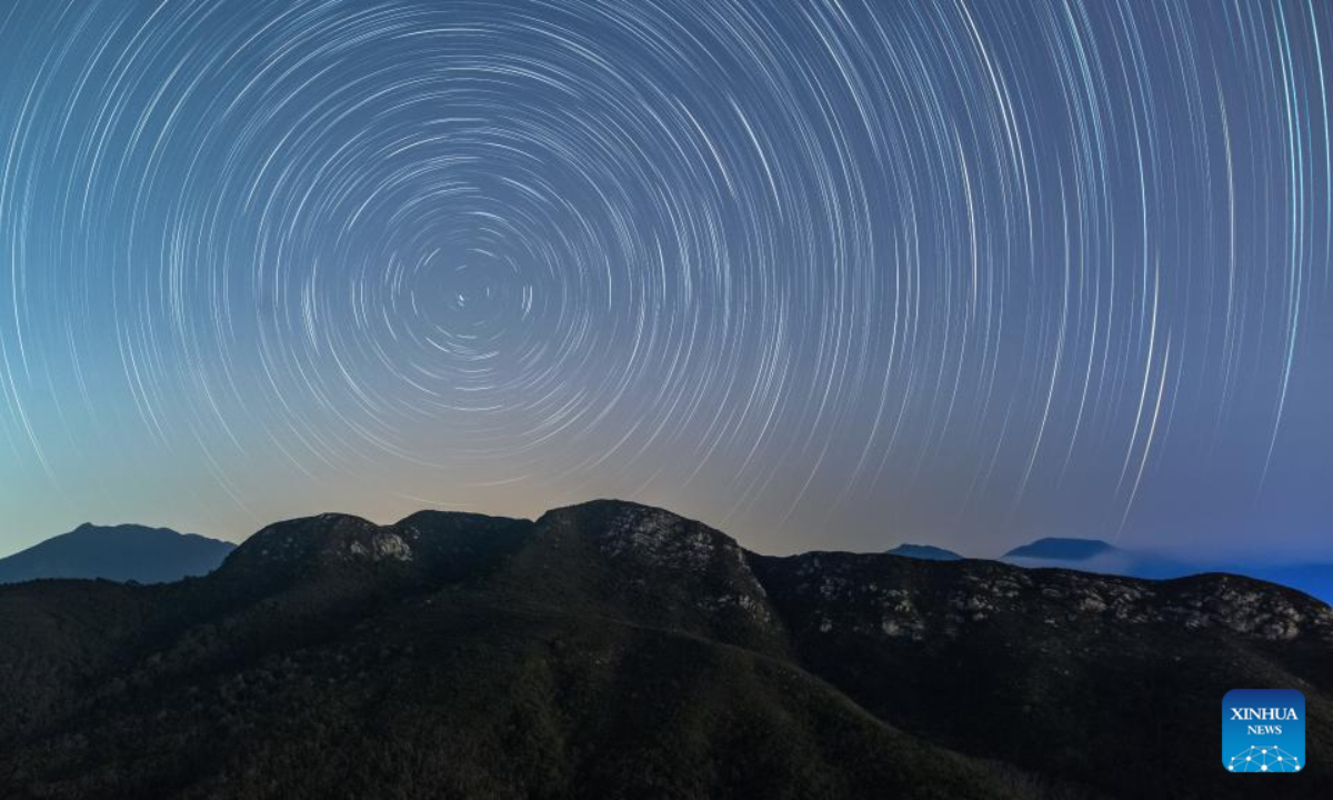 This photomontage taken on April 6, 2023 shows the star trails above Xichong community in Shenzhen, south China's Guangdong Province. Photo:Xinhua