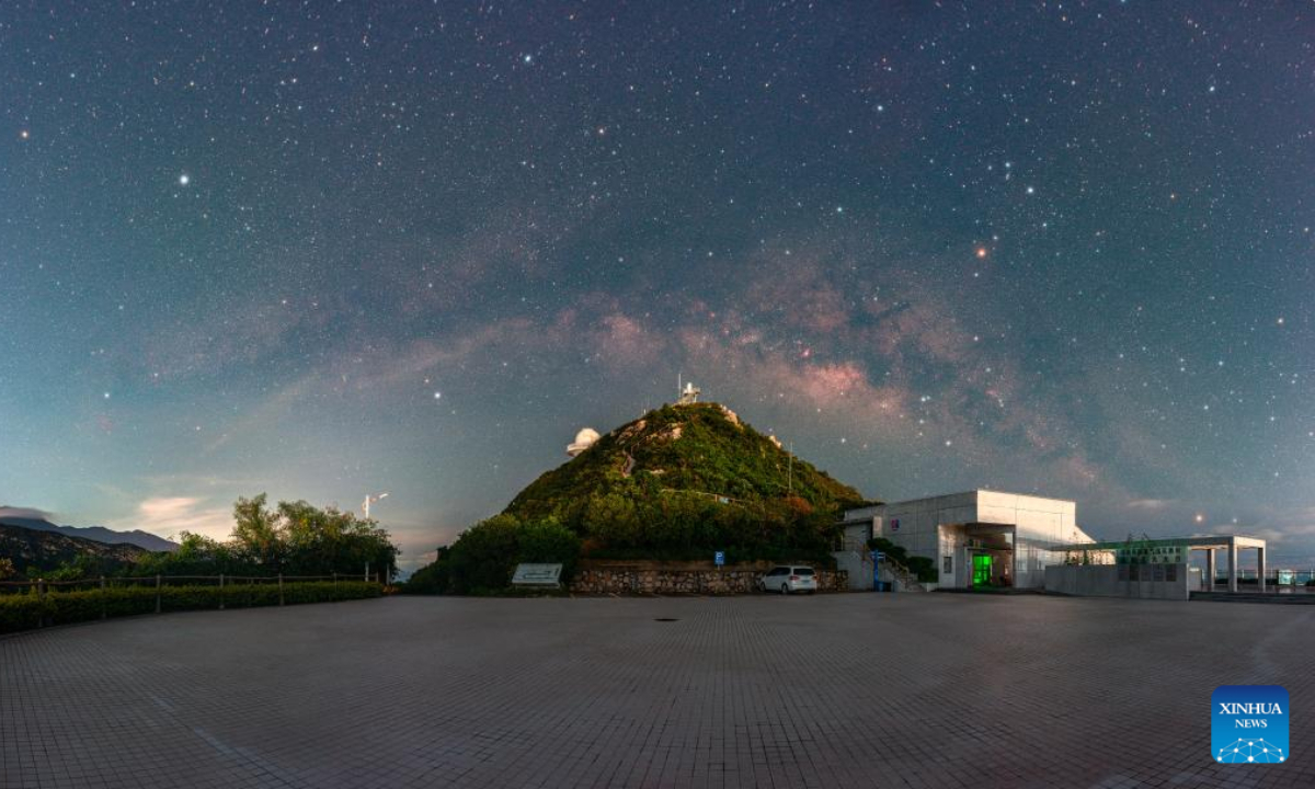 This photomontage taken on June 29, 2022 shows the Milky Way galaxy above the Shenzhen Astronomical Observatory in Shenzhen, south China's Guangdong Province. Photo:Xinhua