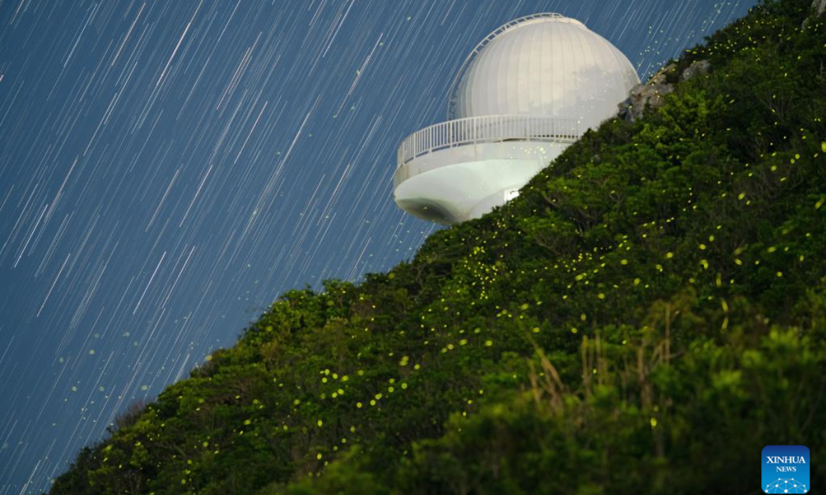 This photomontage taken on July 7, 2021 shows the Shenzhen Astronomical Observatory and flying fireflies in Shenzhen, south China's Guangdong Province. Photo:Xinhua