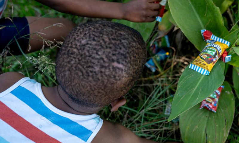 Children participate in an Easter egg hunting event at a park in Johannesburg, South Africa, April 8, 2023. Various activities were held in Johannesburg to mark the upcoming Easter. (Photo by Shiraaz Mohamed/Xinhua)