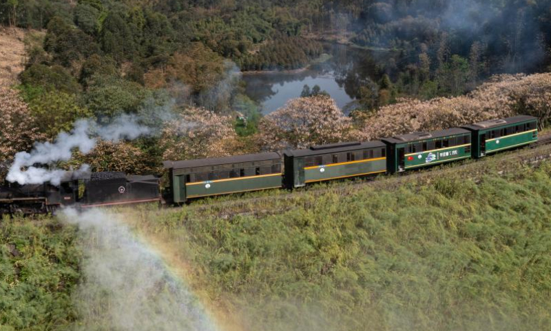 Steam train passes by Liangshuituo station in Leshan, China's Sichuan ...