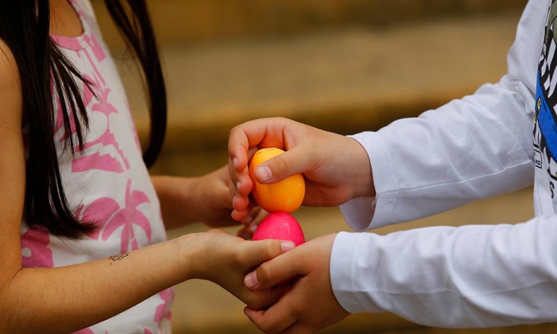 Children tap Easter eggs in Beirut, Lebanon, April 9, 2023. (Xinhua/Bilal Jawich)