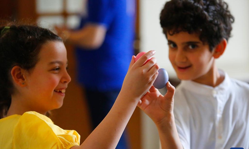 Children tap Easter eggs in Beirut, Lebanon, April 9, 2023. (Xinhua/Bilal Jawich)