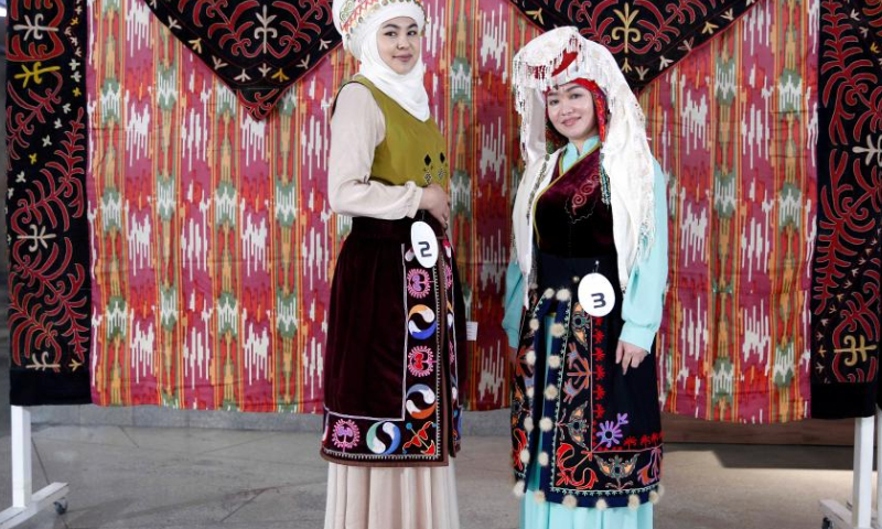 Women display Kyrgyz traditional costumes in Bishkek, Kyrgyzstan, April 15, 2023. An embroidery festival featuring Kyrgyz traditional embroideries was held here on Saturday. (Photo by Roman/Xinhua)