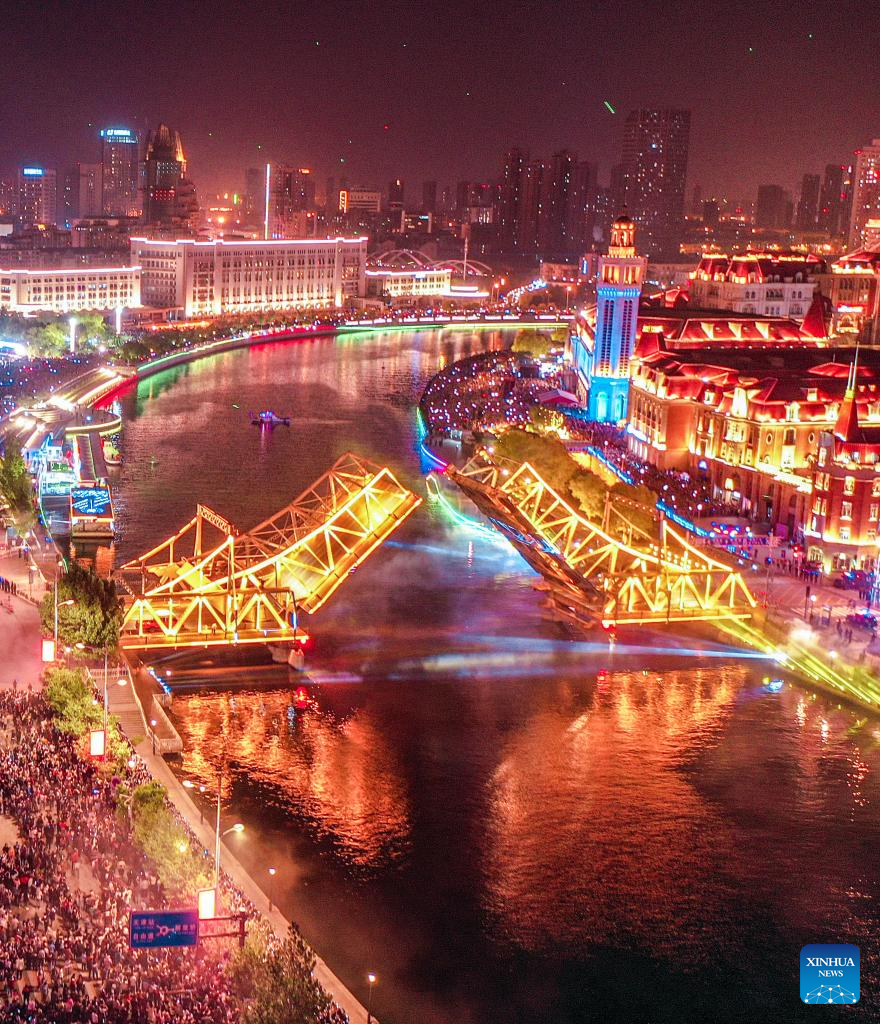 This aerial photo taken on May 1, 2023 shows the opened Jiefang Bridge in Tianjin, north China. The landmark bridge opened on Monday at a maximum angle of 60 degrees. (Xinhua/Sun Fanyue)