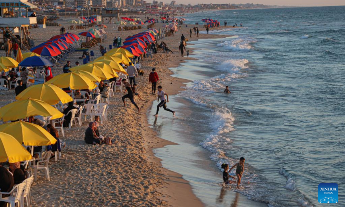 People spend time at the seaside of the Mediterranean Sea off Gaza coast in Gaza City, on April 26, 2023. Photo:Xinhua