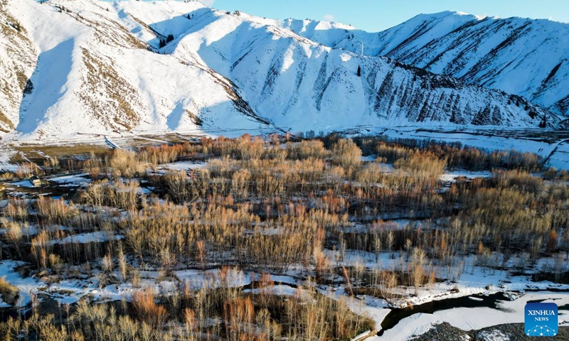 This aerial photo taken on April 9, 2023 shows the scenery of the snow mountains in Koktokay scenic area after spring snow in Fuyun County, northwest China's Xinjiang Uygur Autonomous Region. Koktokay in Xinjiang is rich in tourism resources. The international ski resort in Koktokay is very popular among tourists, which attracts snow lovers from all over the world to ski and enjoy the snow here.(Photo: Xinhua)