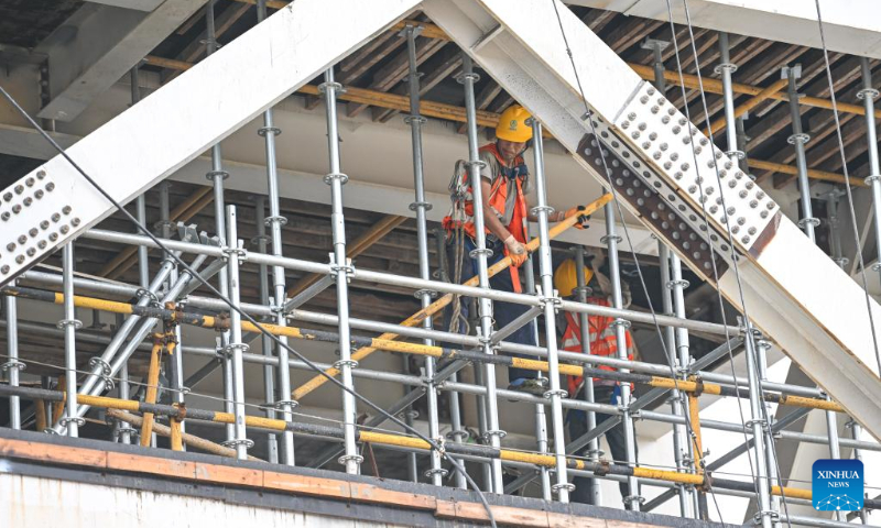 Workers perform tasks at a construction site of the Hainan commercial spacecraft launch site in Wenchang City, south China's Hainan Province, May 13, 2023. (Xinhua/Pu Xiaoxu)