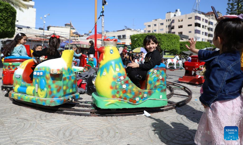 Palestinian children play in a park during the Eid al-Fitr holiday in Gaza City on April 22, 2023. (Photo by Rizek Abdeljawad/Xinhua)