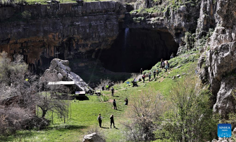 People go hiking in Baatara Pothole in the village of Balaa, Batroun District, Lebanon, April 23, 2023. Baatara Pothole, also known as Balaa Gorge, is located in the village of Balaa in Tannourine of Batroun district in Lebanon. (Xinhua/Liu Zongya)