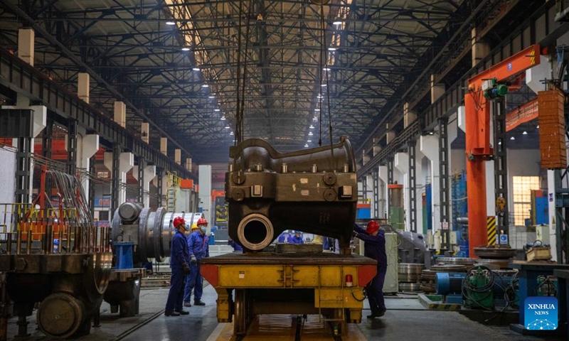 Workers perform production tasks at Harbin Turbine Company Limited of Harbin Electric Corporation in Harbin, capital of northeast China's Heilongjiang Province, April 10, 2023. Harbin Electric Corporation, a veteran state-owned enterprise with a history of over 70 years, has been hailed as the cradle of China's power generation equipment manufacturing industry(Photo: Xinhua)