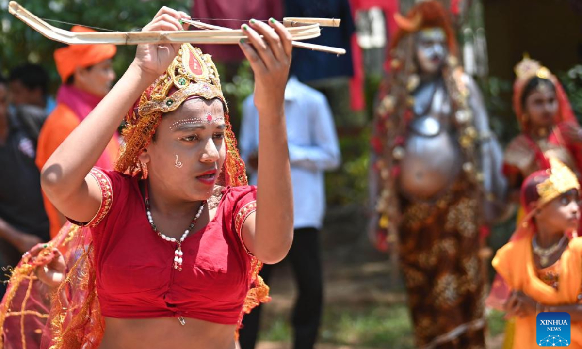 A child in traditional folk attire is seen during the Gajan festival on the outskirts of Agartala, capital city of India's northeastern state of Tripura, April 13, 2023. Photo:Xinhua