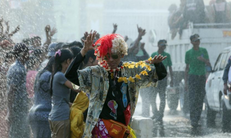 A man participates in the celebration of the water festival in Yangon, Myanmar, April 15, 2023. (Photo by Myo Kyaw Soe/Xinhua)