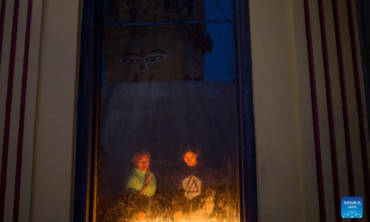 Devotees light oil lamps to mark Buddha Jayanti, the birth anniversary of Lord Buddha, at the Swayambhunath Stupa in Kathmandu, Nepal, May 5, 2023. Every year, Buddha Jayanti is celebrated on the full moon day in the Nepali month of Baishakh marking Buddha's birth, attainment of enlightenment and his death. Photo:Xinhua