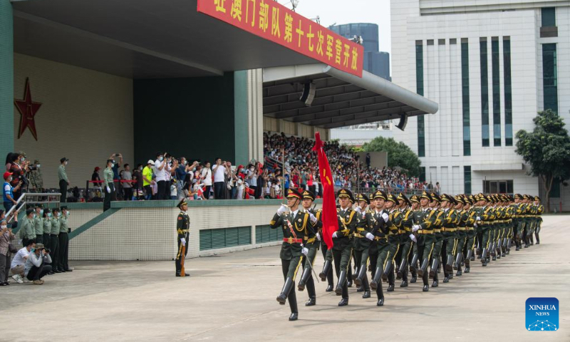 Guards of honor of the Chinese People's Liberation Army Garrison stationed in the Macao Special Administrative Region march during an open day event at the barracks on Taipa Island in Macao, south China, April 30, 2023. This was the 17th time that the barracks had been opened to the public since 2005, helping with communication between the garrison and local residents. (Xinhua/Cheong Kam Ka)