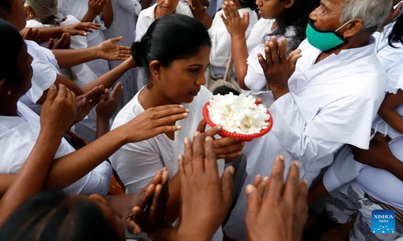 Buddhists are seen in a temple in the outskirts of Colombo, Sri Lanka, May 5, 2023. Sri Lanka celebrated Vesak Day on Friday. (Photo by Ajith Perera/Xinhua)