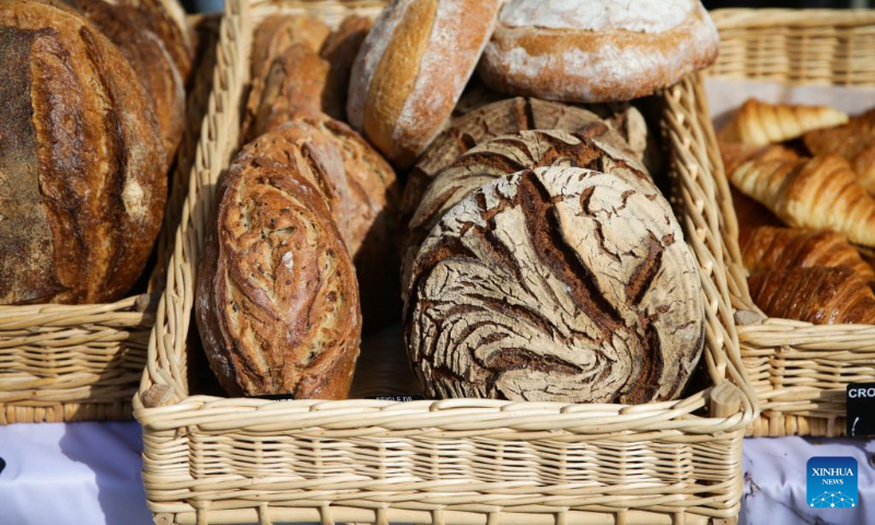 Different kinds of bread are shown at a bread festival in Brussels, Belgium, May 6, 2023. A bread festival was held in Brussels on Saturday to let people taste and buy various kinds of bread product from European countries. (Xinhua/Zheng Huansong)